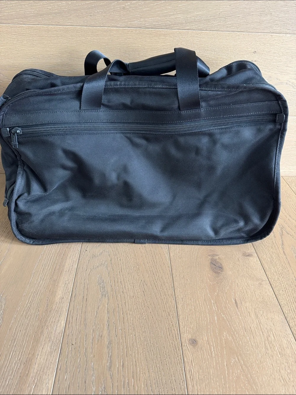 Tumi Black Nylon Duffel Travel Bag with wheels and handle
